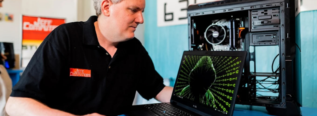 Man working on computer hardware